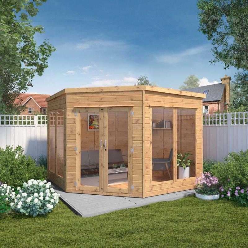 A front view of the Mercia Premium Corner Summerhouse in a sunny garden setting.