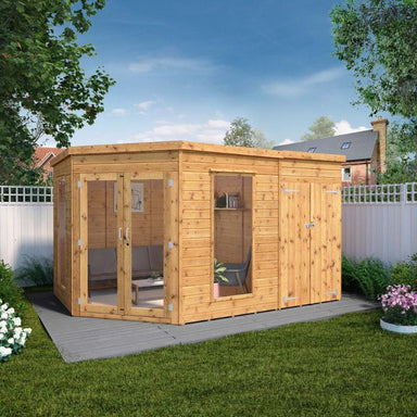 A front view of the Mercia corner summerhouse with side shed 12x8 in a sunny garden setting.