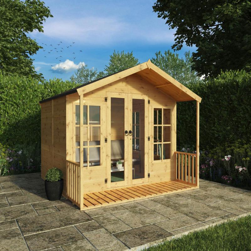 A front-right side view of the Mercia Wessex 8x8 foot summerhouse in a sunny garden setting with lots of greenery.