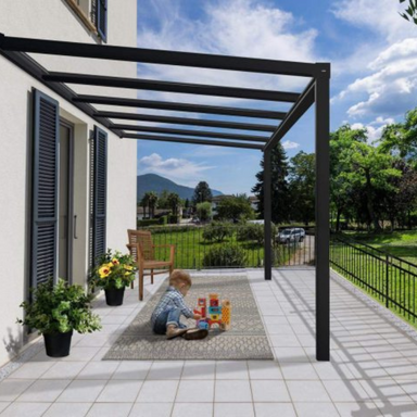 The Palram-Canopia Stockholm patio cover with a child playing underneath.