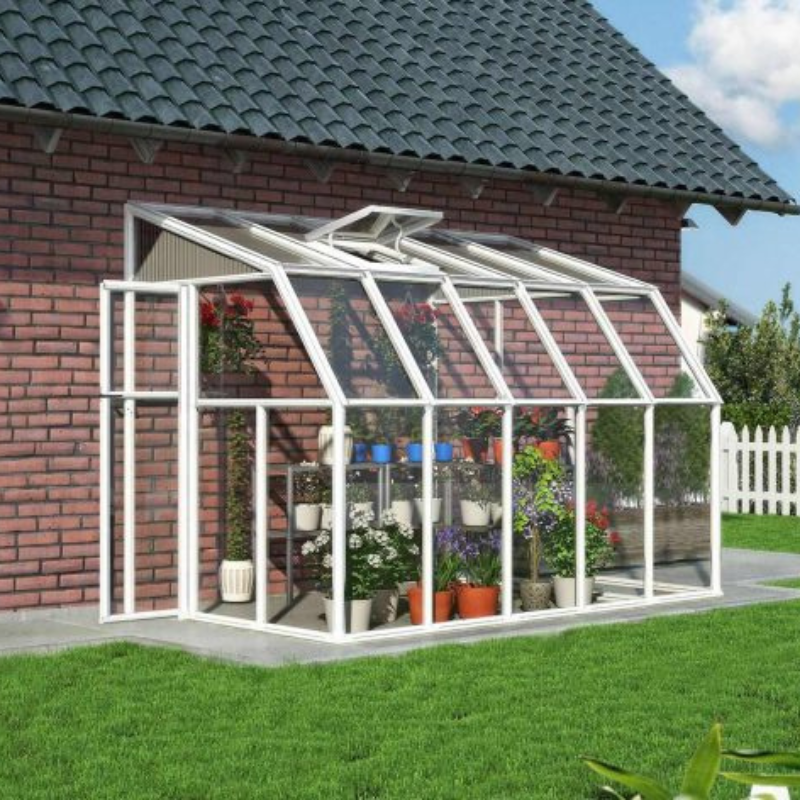 The Palram Sunroom attached to a building showcasing an arrangement of flowers.