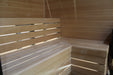 Wooden bench in a sauna with wooden walls.