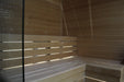 Wooden sauna with bench and glass door