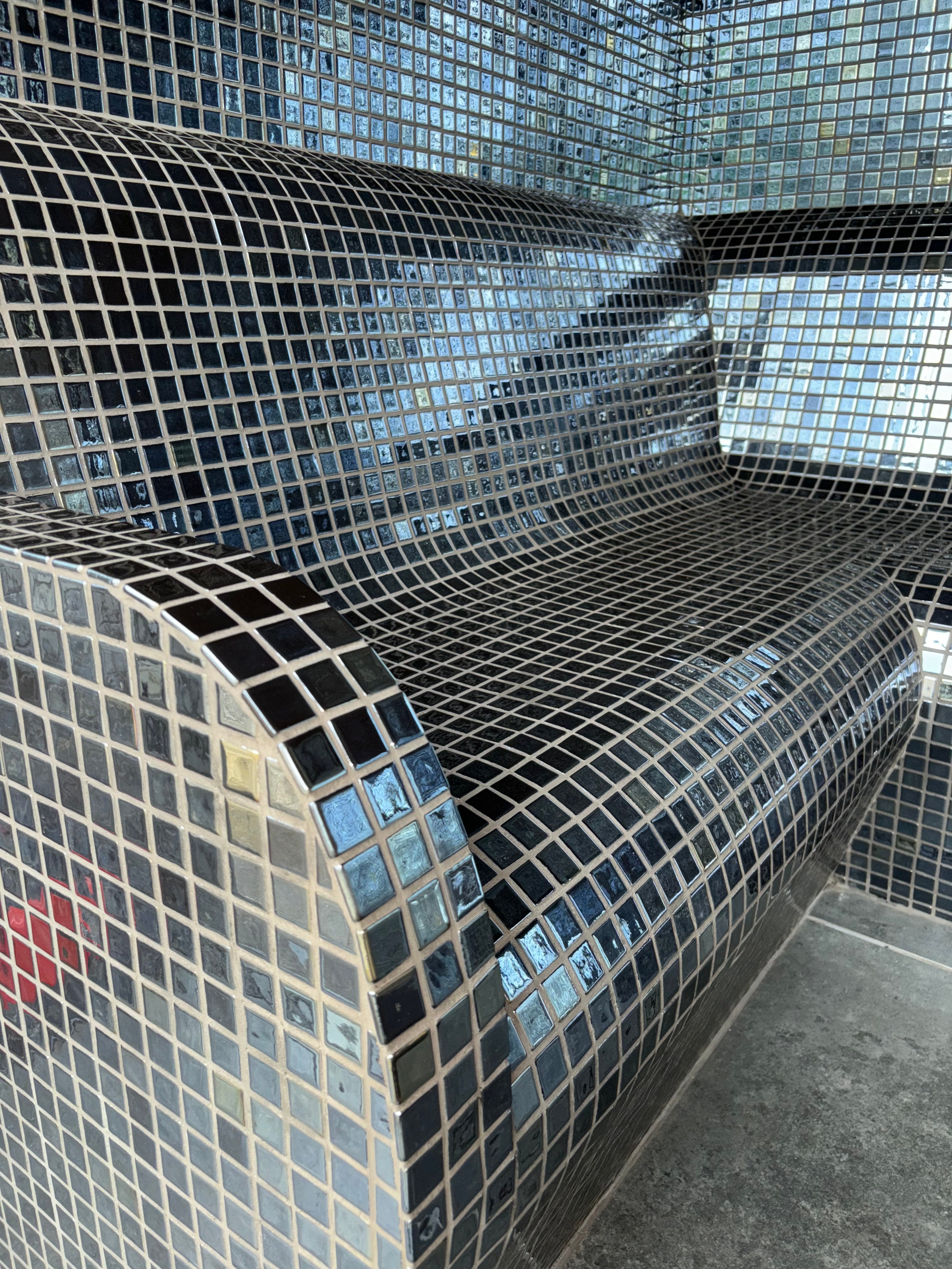 Close up of the mosaic tiled bench in the steam room of the one spa duo