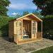The Mercia Wessex summerhouse in a garden on a summers day with open double doors.