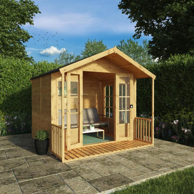 The Mercia Wessex summerhouse in a garden on a summers day with open double doors.