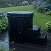 Polar Recovery Cyclone wooden ice bath in black with lid and steps on wet patio