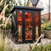 Polar Recovery Eclipse 3 person outdoor infrared sauna, couple relaxing inside in garden