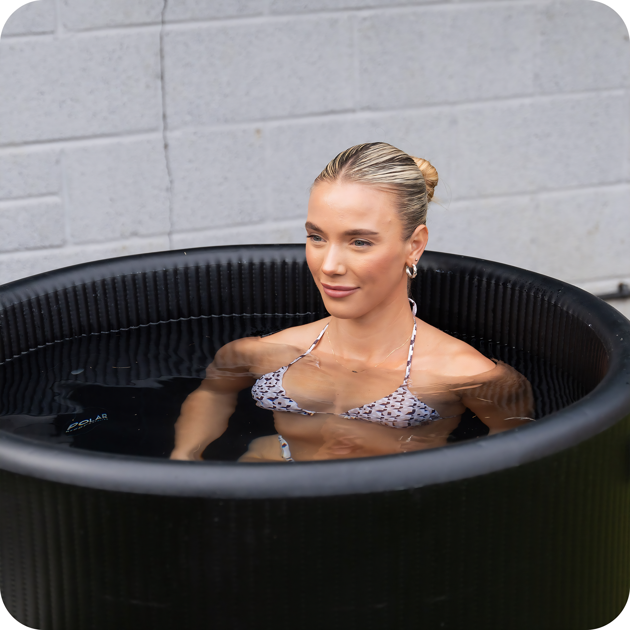 Polar Recovery Elite portable ice bath, close-up of woman bathing