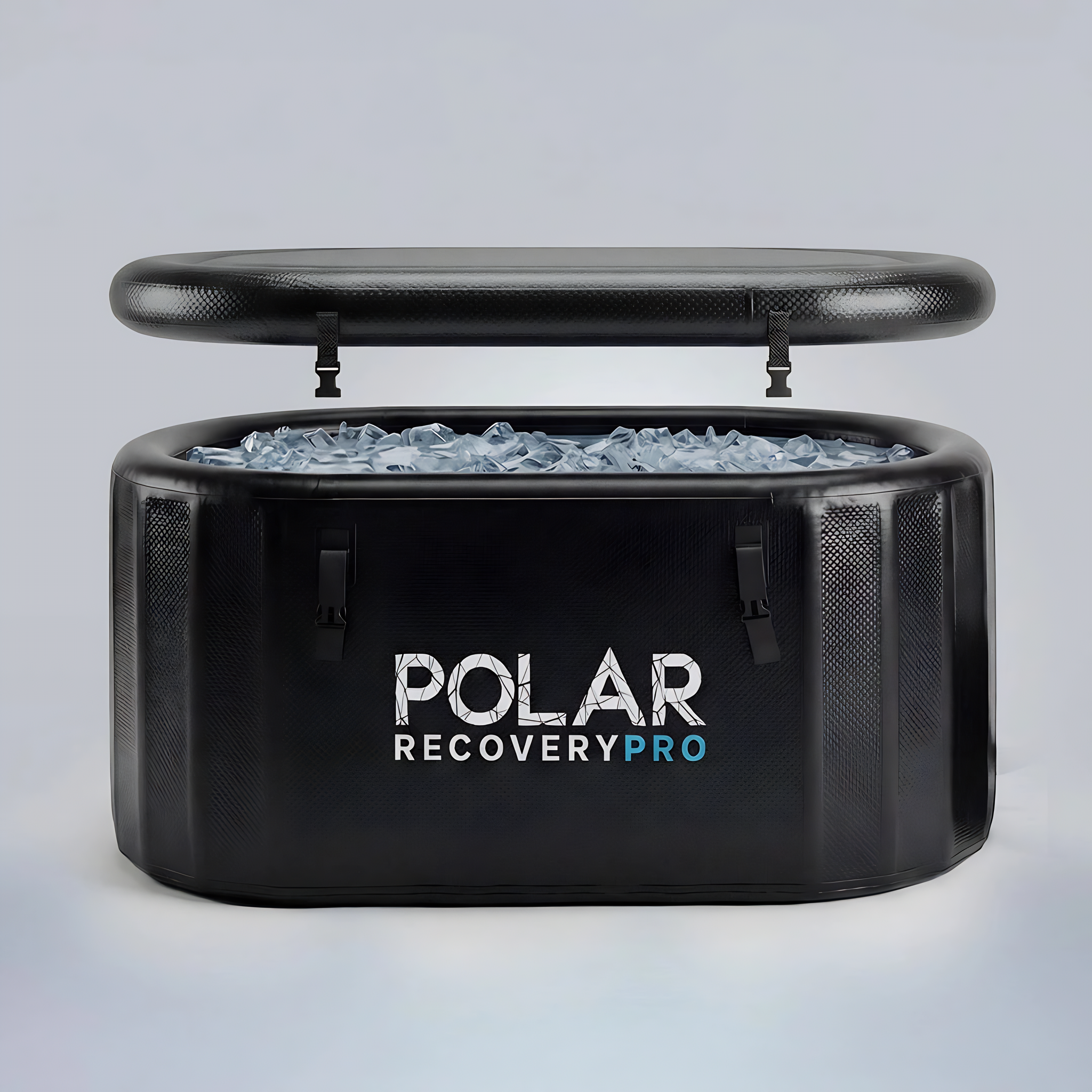 Polar Recovery Pro inflatable ice bath in black filled with ice, lid raised