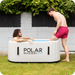 Polar Recovery Pro inflatable ice bath in grey, two men in garden