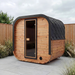 Polar Recovery Sauna Cube 3-5 person outdoor sauna with wood front on a garden patio