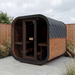 Polar Recovery Sauna Cube 6-8 person outdoor sauna with glass front on a garden patio