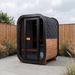 Polar Recovery Sauna Cube Mini 2 person outdoor sauna with glass front on garden patio