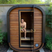 Polar Recovery Sauna Cube Mini 2 person outdoor sauna, man sitting inside with the door open