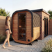 Polar Recovery Sauna Cube Mini 2 person outdoor sauna, woman walking to wood front